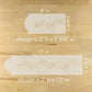Two stencils with musical note design on a wooden surface, showing measurements.