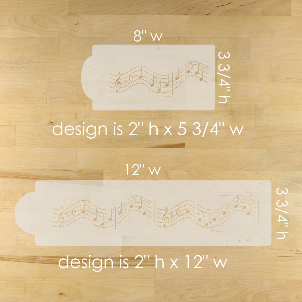 Two stencils with musical note design on a wooden surface, showing measurements.