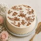 French Toile Cake Stencil top applied to the top of a wedding cake