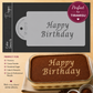 Cake stencil with 'Happy Birthday' design on a tiramisu dessert