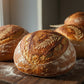 Decorative wheat design on top of a sourdough loaf 