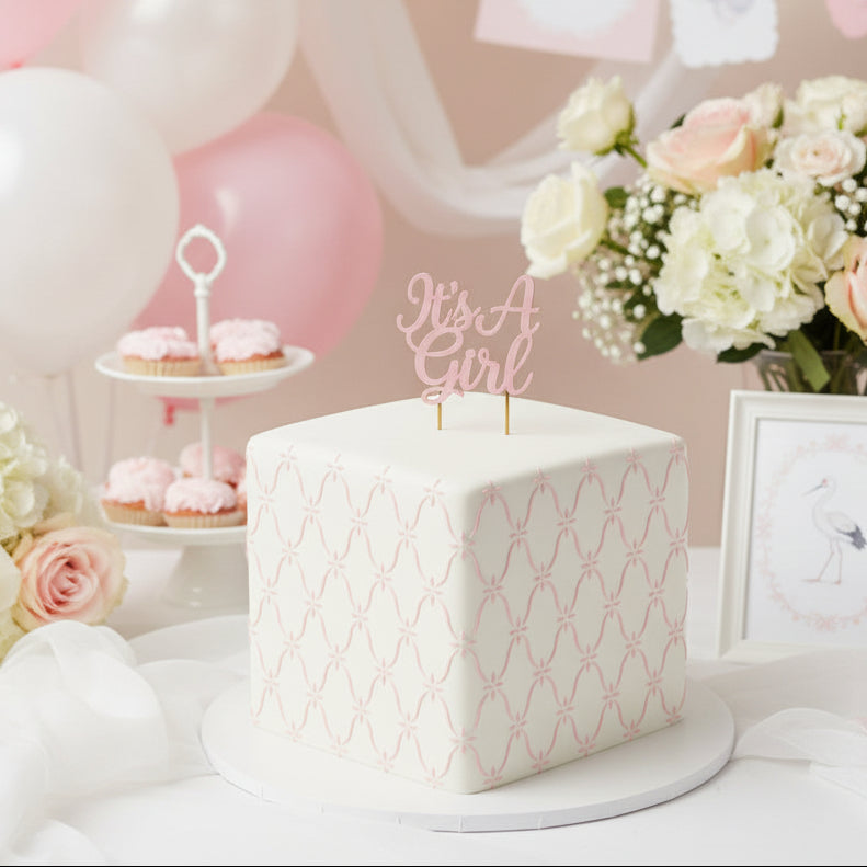 Lattice cake stencil applied to the sides of a cake for a little girl's baby shower.