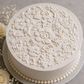 Chic Rose Stencil Topper for round cakes applied with buttercream to a wedding cake.