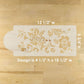 Decorative cake stencils with floral designs on a wooden surface, showing measurements.