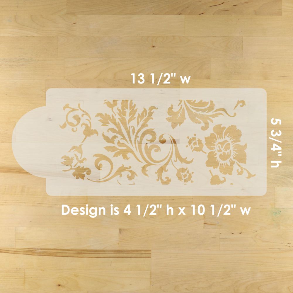 Decorative cake stencils with floral designs on a wooden surface, showing measurements.