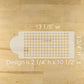 Cake stencil with houndstooth pattern on a wooden table, showing measurements.