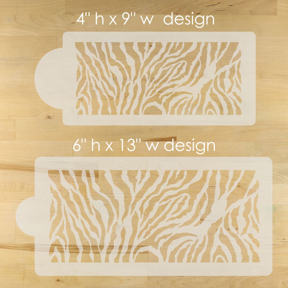 Two stencils with zebra pattern on a wooden surface