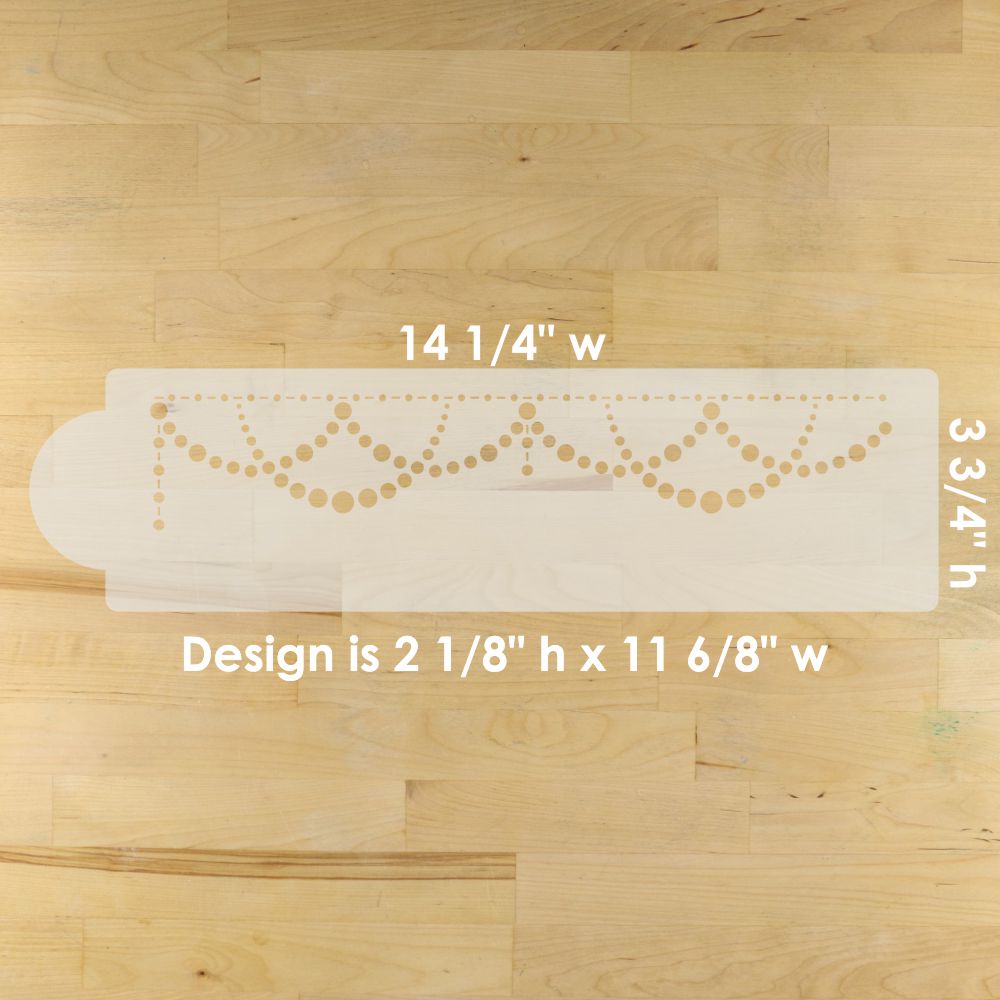 Cake Stencil with decorative design on a wooden floor, showing measurements.
