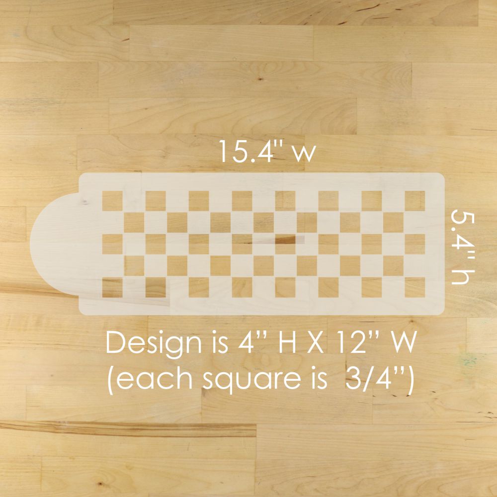 Checkerboard patterned stencil with measurements on a wooden surface