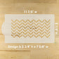 Chevron patterned cake stencil with measurements on a wooden surface