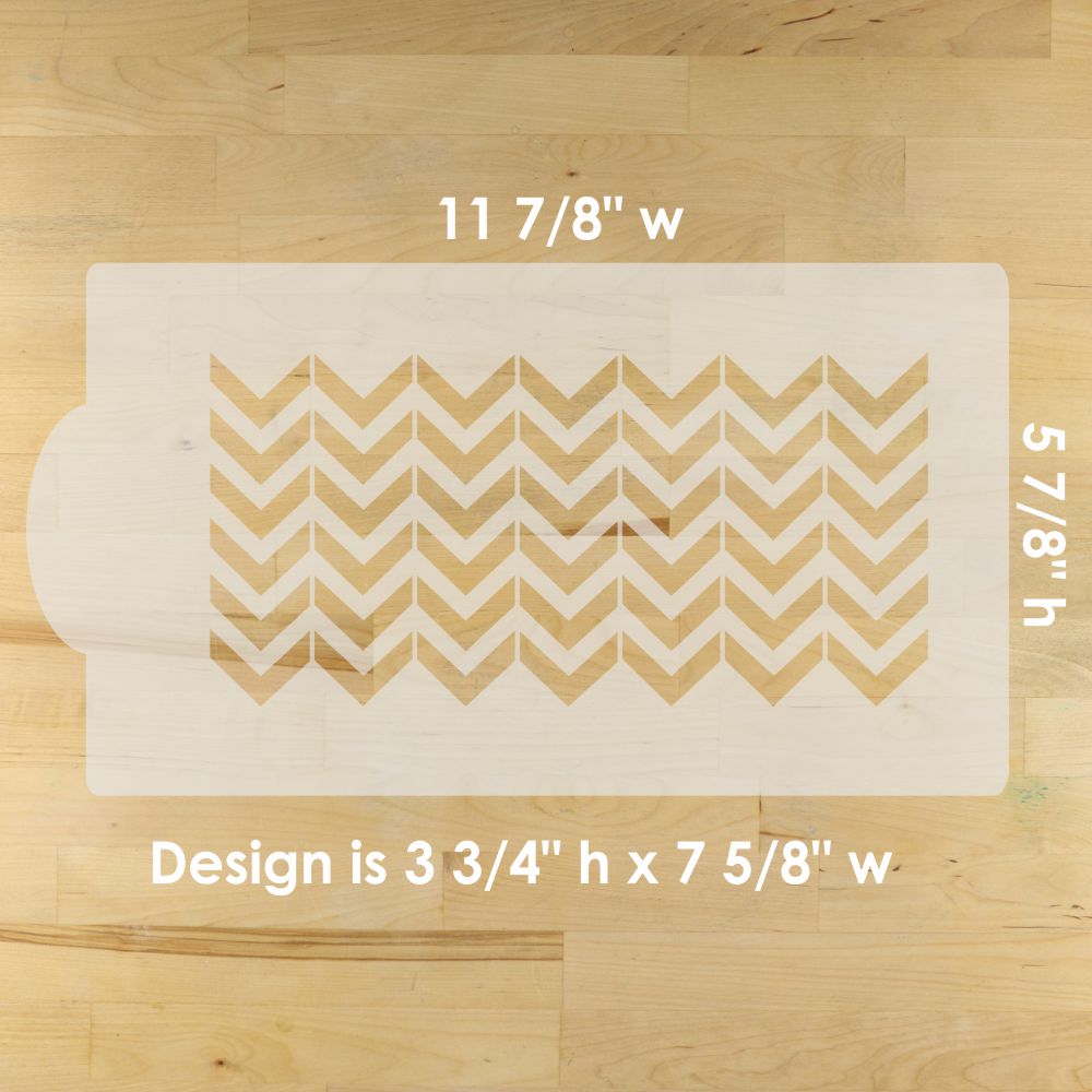 Chevron patterned cake stencil with measurements on a wooden surface
