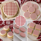 Collage of red and white patterned cookies and cupcakes with a 'Roll Tide' theme decorated with fashion-inspired cake stencil