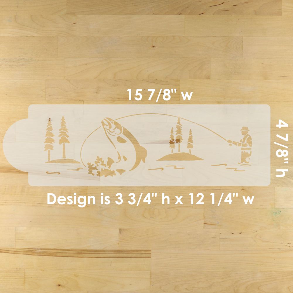 Cake stencil with fishing design and measurements on a wooden surface