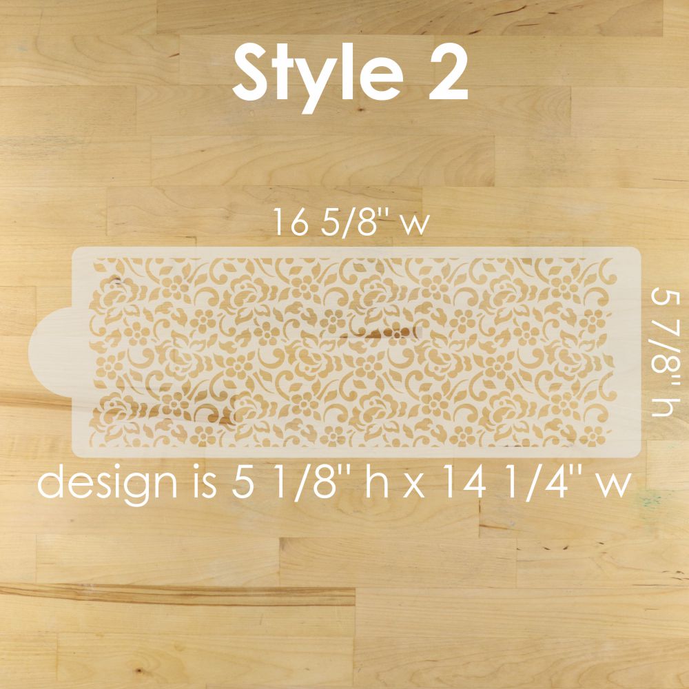 Decorative stenciled design on a wooden surface with measurements.