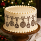 Christmas ornament cake stencil applied to the side of a holiday cake