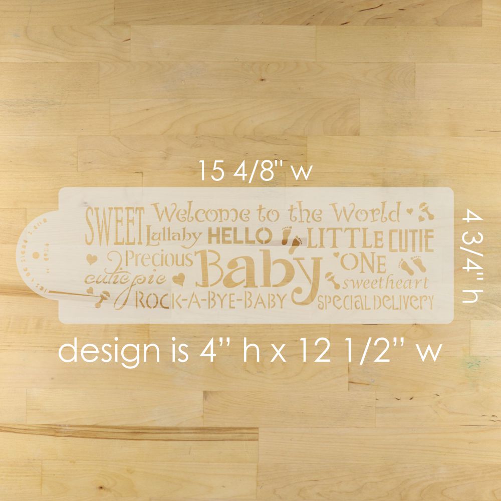 Baby Shower cake stencil on a wooden surface with the stencil dimensions.