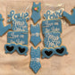 Decorative cookies with text and designs on a wooden surface