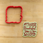 Cookie flooded and stenciled with the It's the Most Wonderful Time of the Year Cookie Stencil by Designer Stencils lying next to its matching cookie cutter.