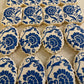 Cookies with blue floral patterns on a white surface