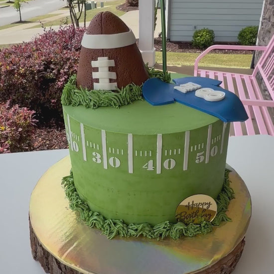 Video by Liz Betts showing off her cake using football cake stencils