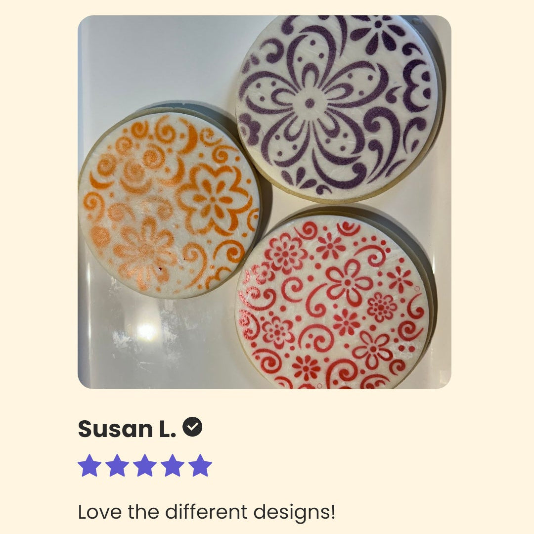 Decorative cookie cutters with floral designs on a beige background, reviewed by Susan L.