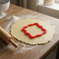 Alford Plaque Cookie Cutter being used on rolled out cookie dough