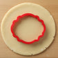 Barnes Plaque Cookie Cutter being used on cookie dough